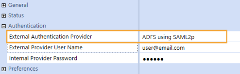 The System Security user configuration page has a grid with row headings that have a blue background with blue text and can be expanded to display fields with a white background and black text. Under the Authentication row heading, the External Authentication Provider field has an ADFS SAML identity provider selected.