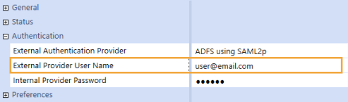 The System Security user configuration page has a grid with row headings that have a blue background with blue text and can be expanded to display fields with a white background and black text. Under the Authentication row heading, the External Provider User Name field has an email address.